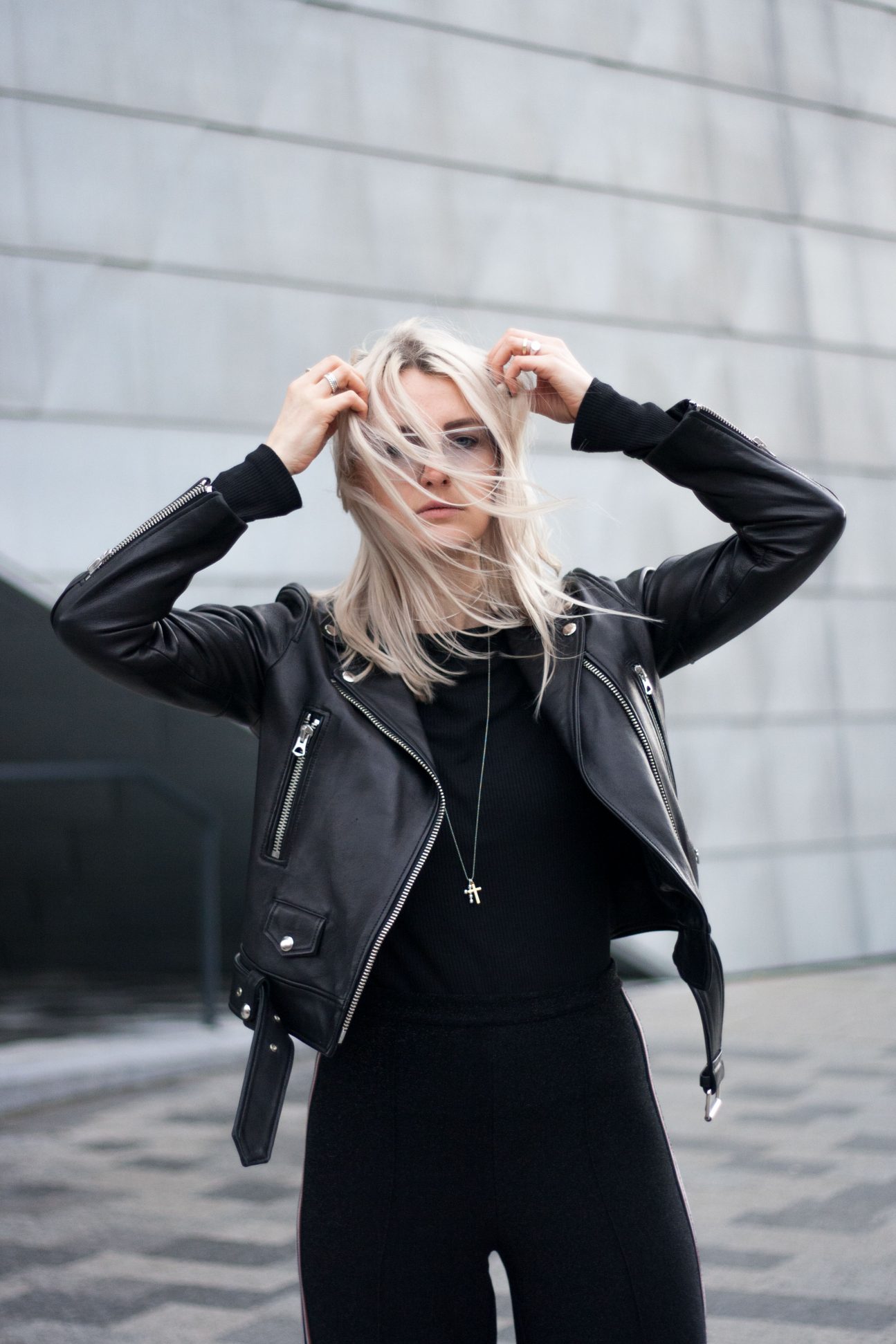 black lurex track pants with leather jacket